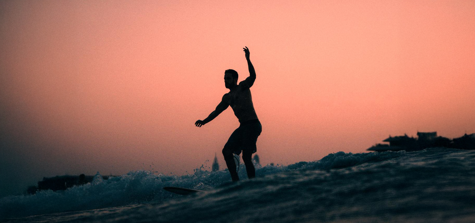 Surfing at sunset